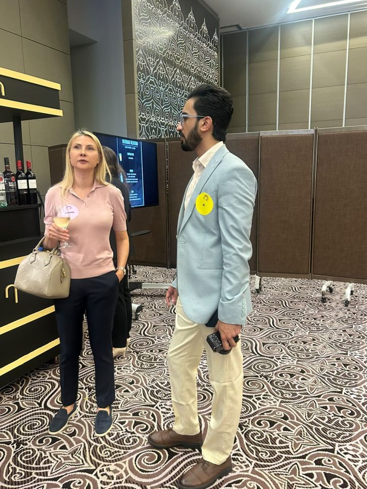 Tejwaans Corporate Group team member in conversation with a professional at Back to Business in Qatar
