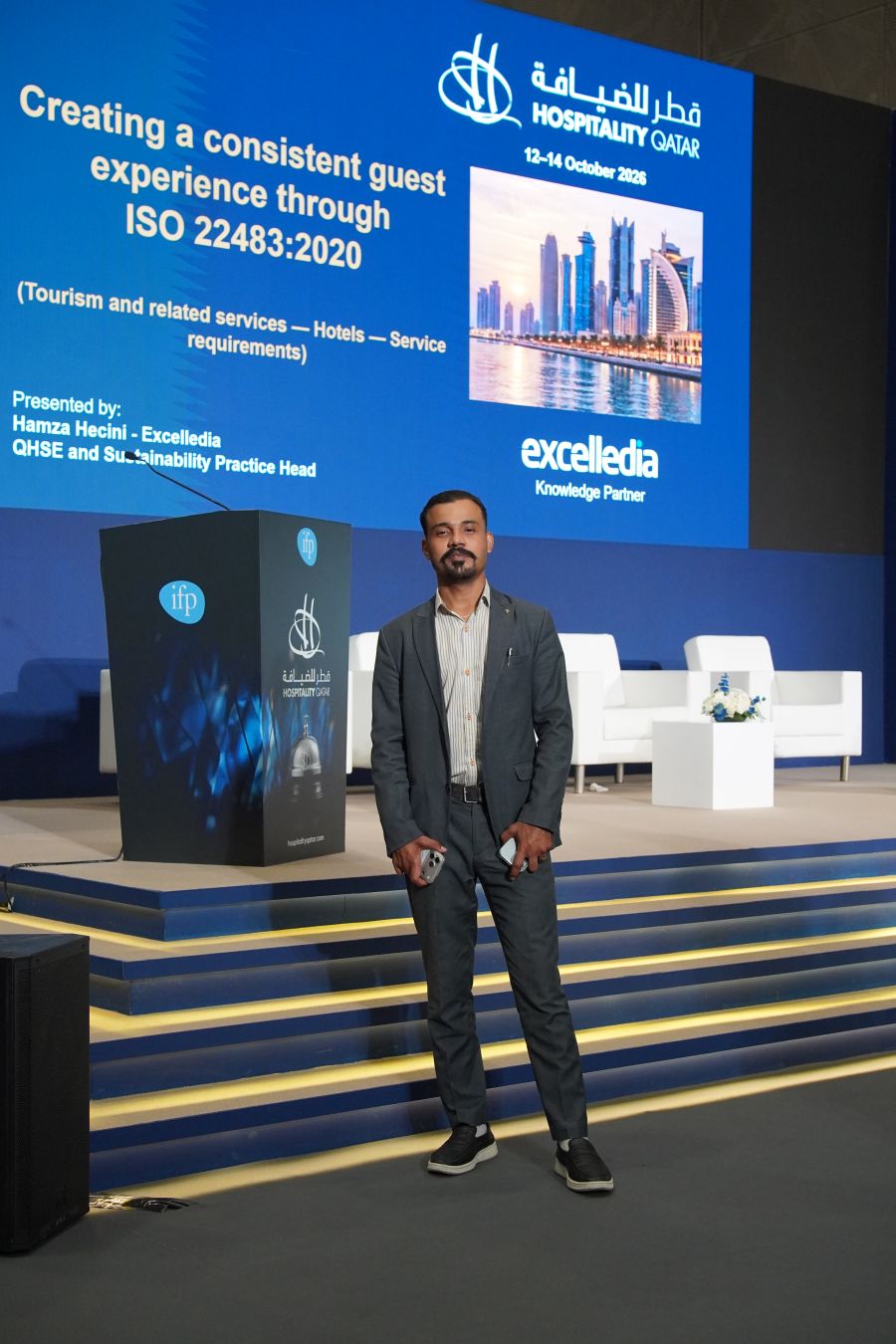 Tejwaans team member at the Hospitality Qatar 2026 presentation on ISO 22483:2020 hotel service requirements