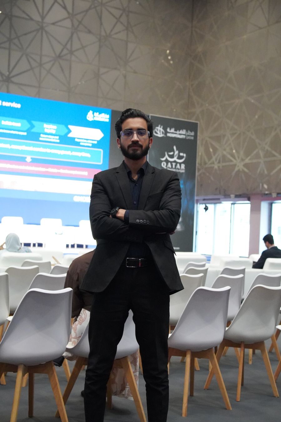 Tejwaans team member in the seminar area at Hospitality Qatar 2026 in Doha